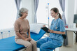 © Witoon - Portrait of beautiful doctor sharing data from digital tablet with elderly patient