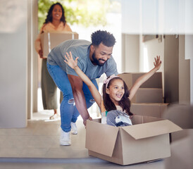 Happy family, real estate and moving in new home with box for property, mortgage loan or celebration. Mother, father and little girl enjoying playing with boxes for fun relocation together in house