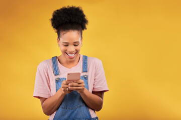 Mockup, typing and happy woman with phone in studio, texting or social media post with space on yellow background. Networking, chat online and model with cellphone mobile app, reading meme or email