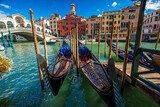 Fototapeta Góry - Beautiful view of a canal in Venice with gondolas, Venice, Italy, Europe.