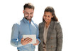 Modern business people are working using digital tablet and smiling while standing on a transparent background