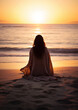© j - woman on the beach at sunset
