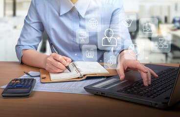 businessman  using smart phone with laptop and digital computer and document on desk in modern office with virtual interface graphic icons network diagram