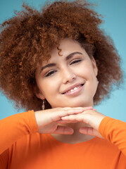 Wall Mural - Beauty, smile and portrait of woman on blue background enjoying calm weekend, freedom and relaxing. Fashion, trendy style and face zoom of happy girl with confidence, positive attitude and cosmetics