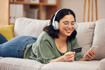 Sticker - Woman, credit card and phone on sofa, home and headphones with smile, online shopping or payment on web. Girl, smartphone and fintech app for cybersecurity, discount and deal with e commerce store