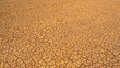 AERIAL: Pattern of cracks on a desolate desert landscape due to lack of rain