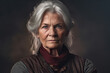 © Justlight - A confident elderly woman stands with arms folded across her chest her regal silver hair in a flattering bobstyle her eyes focused .