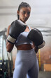 © Martina Monti/peopleimages.com - Young indian woman, boxing gym and portrait in gloves for fight, training or workout for health. Athlete girl, box club and exercise for conflict, performance and power with wellness, sport and goals
