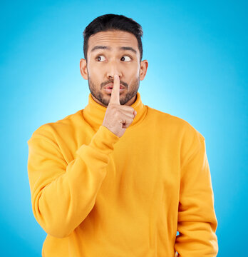 Secret, man and finger on lips for privacy, confidential information or sign with hand to whisper, gossip or quiet voice. Announcement, emoji or person for communication, noise or silence of sound