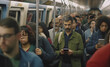 © Rodrigo - Modern Commuting: Men Embracing Connectivity on Subway Public Transportation