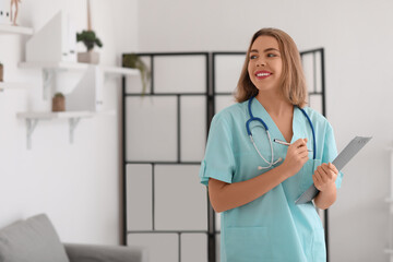 Wall Mural - Female medical assistant with document in modern clinic