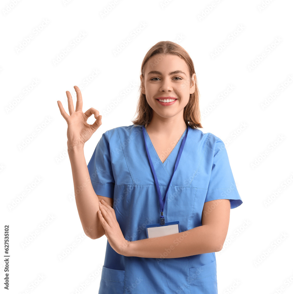 Female intern showing OK on white background