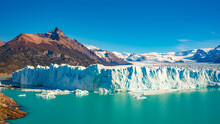 Panoramic Over Big Perito Moreno Glacier In Patagonia With Blue Sky And Turquoise Water Glacial Lagoon, South America, Argentina, In Autumn Colors