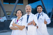 © PRASANNAPIX - Successful team of medical doctors showing thumps up