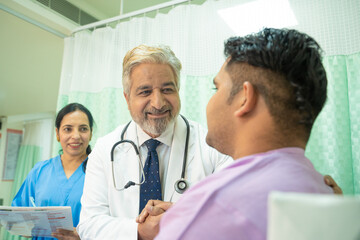 Wall Mural - Doctor helping and support to patient while medical examination. trust and ethic concept.