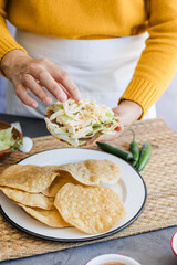 Sticker - mexican tostadas with chicken, cooking traditional homemade food in Mexico Latin America
