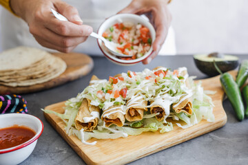 Mexican tacos dorados called flautas with chicken, traditional fried food in Mexico Latin America