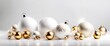 Golden and white Christmas balls on a white background. Festive xmas decoration gold bauble and bright snowflake.