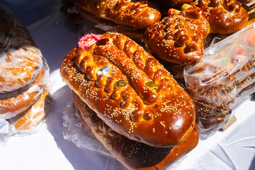 The guaguas de pan or pan dolls are sweets that consist of large loaves of bread molded and decorated in the shape of a small child. They are traditional in the city of Cusco and the the Andes in Peru