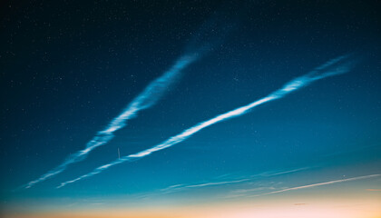 Wall Mural - Night Starry Sky And Noctilucent Clouds Above Summer Meadow Landscape. Glowing Stars And Night Shining Clouds. Tenuous Cloud-like Phenomena In The Upper Atmosphere Of Earth.