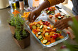 © Wavebreak Media - Hands of plus size african american woman in apron preparing meal in kitchen