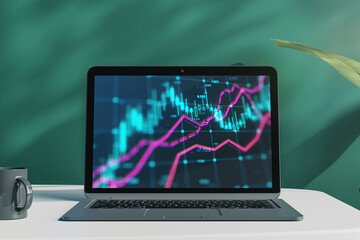 Poster - Close up of laptop with forex chart on screen at office workplace with coffee cup, plant and chalkboard wall background. Market, finance and online trading concept. 3D Rendering.