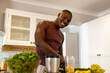 © Wavebreak Media - Portrait of happy african american man preparing healthy smoothie in kitchen at home