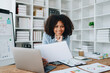 © Jirapong - financial, Planning, Marketing and Accounting, portrait of african american employee checking financial statements using documents and calculators at work
