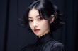 © Surachetsh - an exquisite black gown, the young Asian woman exudes elegance and luxury, epitomizing a contemporary fashion style with a dark mood and tone. Generative AI.