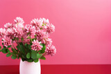 Fototapeta Kosmos - Bouquet of red clover on pink background with copy space for text