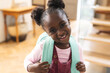 © Wavebreak Media - Portrait of happy african american girl wearing backpack