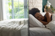 © Wavebreak Media - Biracial woman sleeping in bed in bedroom