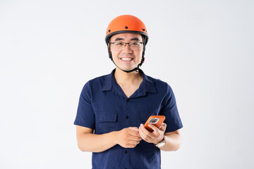 Wall Mural - man wearing orange helmet on white background