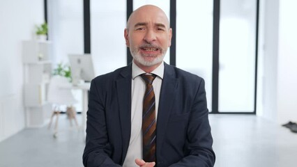 Aufkleber - Middle-aged white man in a suit talking in the office. Job interview. Online meeting.