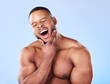 Tired, yawning and a black man with skincare on a blue background for beauty and wellness. Health, model and an African person or model with fatigue isolated on a studio backdrop for wellbeing