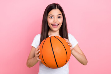 Wall Mural - Photo portrait of cute schoolgirl excited shocked basketball match support dressed stylish white clothes isolated on pink color background