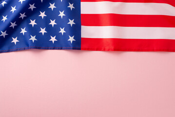 Wall Mural - Honoring American Labor Day in style. High angle view photo capturing an American flag on a pink isolated backdrop, providing ample space for text or adverts