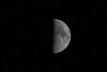 Wall Mural - half moon taken july 25, 2023 above ottawa, canada against a black background.