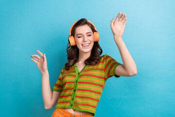 Poster - Photo of careless youngster girl listen favorite music playlist youtube itunes app headphones dance isolated on blue color background