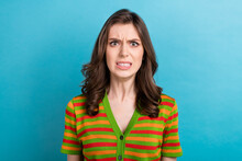 Photo Of Pretty Aggressive Dissatisfied Girl With Curly Hairstyle Wear Striped Shirt Clenching Teeth Isolated On Blue Color Background