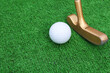 Mini golf course, mini golf ball close-up. Green artificial grass on the mini golf course