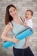 © auremar - woman going to exercise class with her baby
