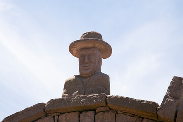 Stone heads carved into the arches on the island of Taquile on Lake Titicaca in Peru.