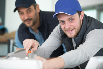 two men in building partnership working together