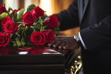 Man At Funeral Near Coffin With Red Flowers. Generative AI.