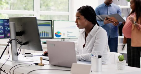 Wall Mural - African Financial Data Analysts Using Dashboard On Screens