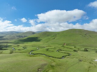 aerial view of mountain clouds and meanders