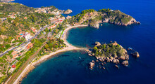 Aerial View Of Isola Bella In Taormina, Sicily, Italy. Isola Bella Is Small Island Near Taormina, Sicily, Italy. Narrow Path Connects Island To Mainland Taormina Beach In Azure Waters Of Ionian Sea.