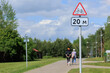 Information board or road sign for cyclists on the street on a summer day