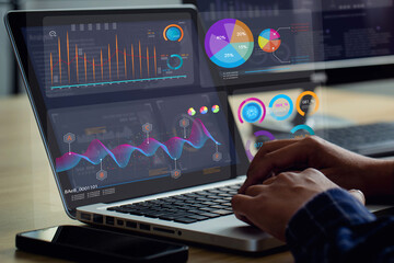 Fototapete - Analyst uses a laptop Showing business analytics dashboard with charts, metrics, and KPI to analyze performance and create insight reports for operations management.Data analysis.sales, marketing.Ai